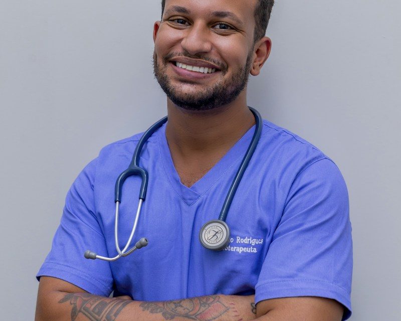 Smiling doctor in scrubs with a stethoscope